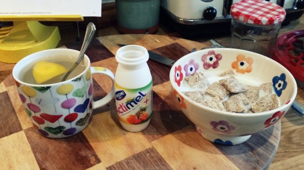 Lemon, honey and ginger, an actimel and a bowl of apricot wheats with organic semi skimmed milk
